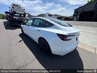 Tesla Model 3 auto transport pickup in St Paul, Minnesota before shipping to Irvine, California