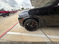 BMW X5 auto transport pickup in San Antonio, Texas before shipping to Cave Springs, Arkansas