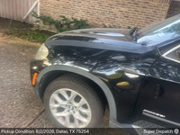 BMW X5 auto transport pickup in Dallas, Texas before shipping to Canton Township, Michigan