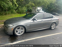 BMW 5 Series auto transport pickup in Tewksbury, Massachusetts before shipping to Houston, Texas