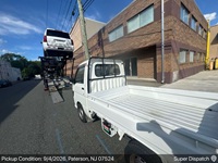 Dodge Avenger auto transport pickup in Paterson, New Jersey before shipping to Rockford, Michigan