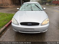 Ford Taurus auto transport pickup in Seattle, Washington before shipping to Pearland, Texas