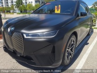 BMW iX auto transport pickup in Pompano Beach, Florida before shipping to Clayton, North Carolina